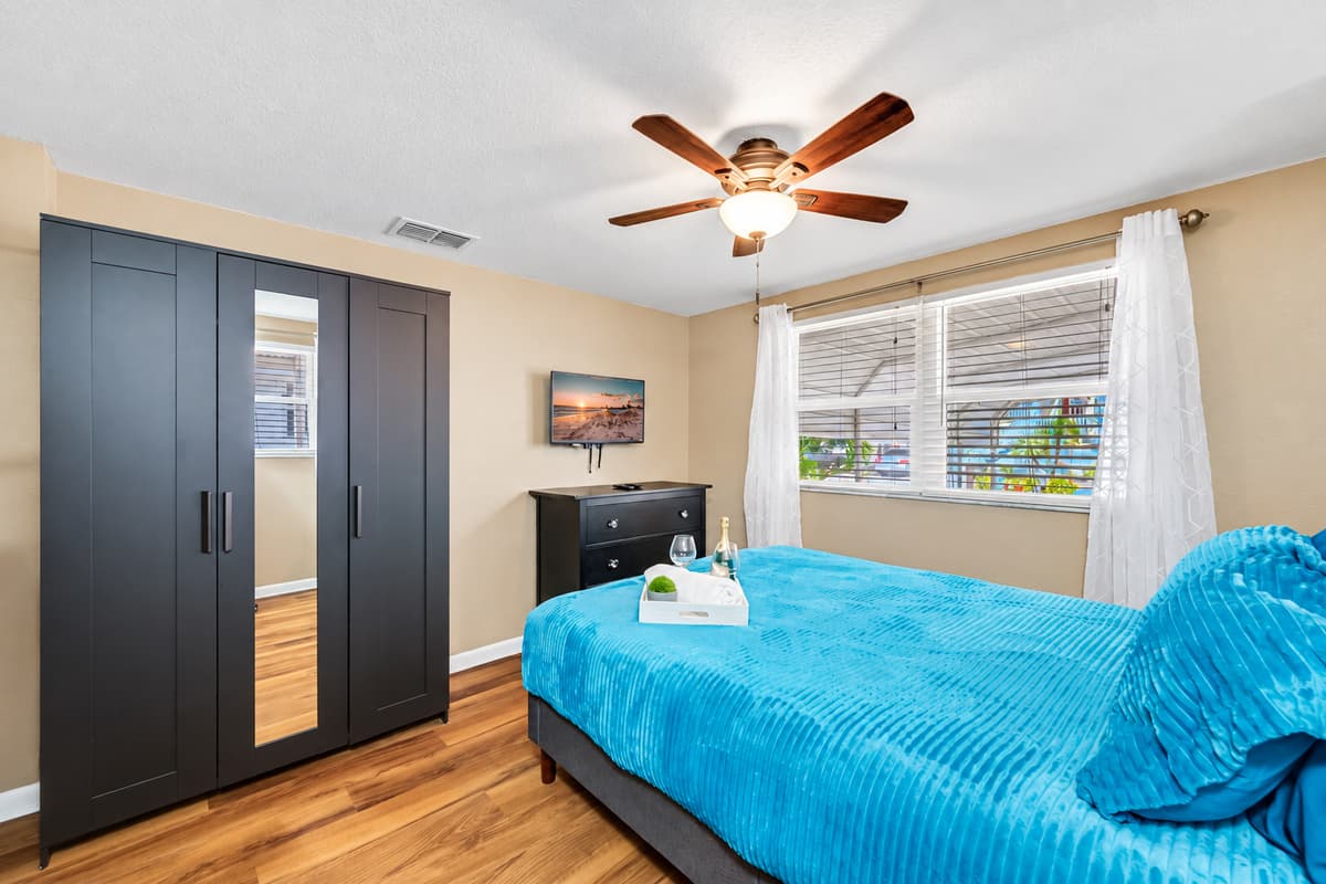Impeccable bedroom with a queen sized bed, twin bunk bed, closet and a smart TV. Perfect for a group of friends or a family with kids.