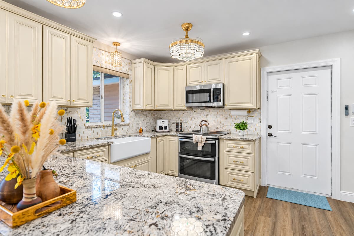 Cook with ease in this spacious, fully equipped kitchen featuring stainless steel appliances, generous prep space, and stylish finishes throughout.