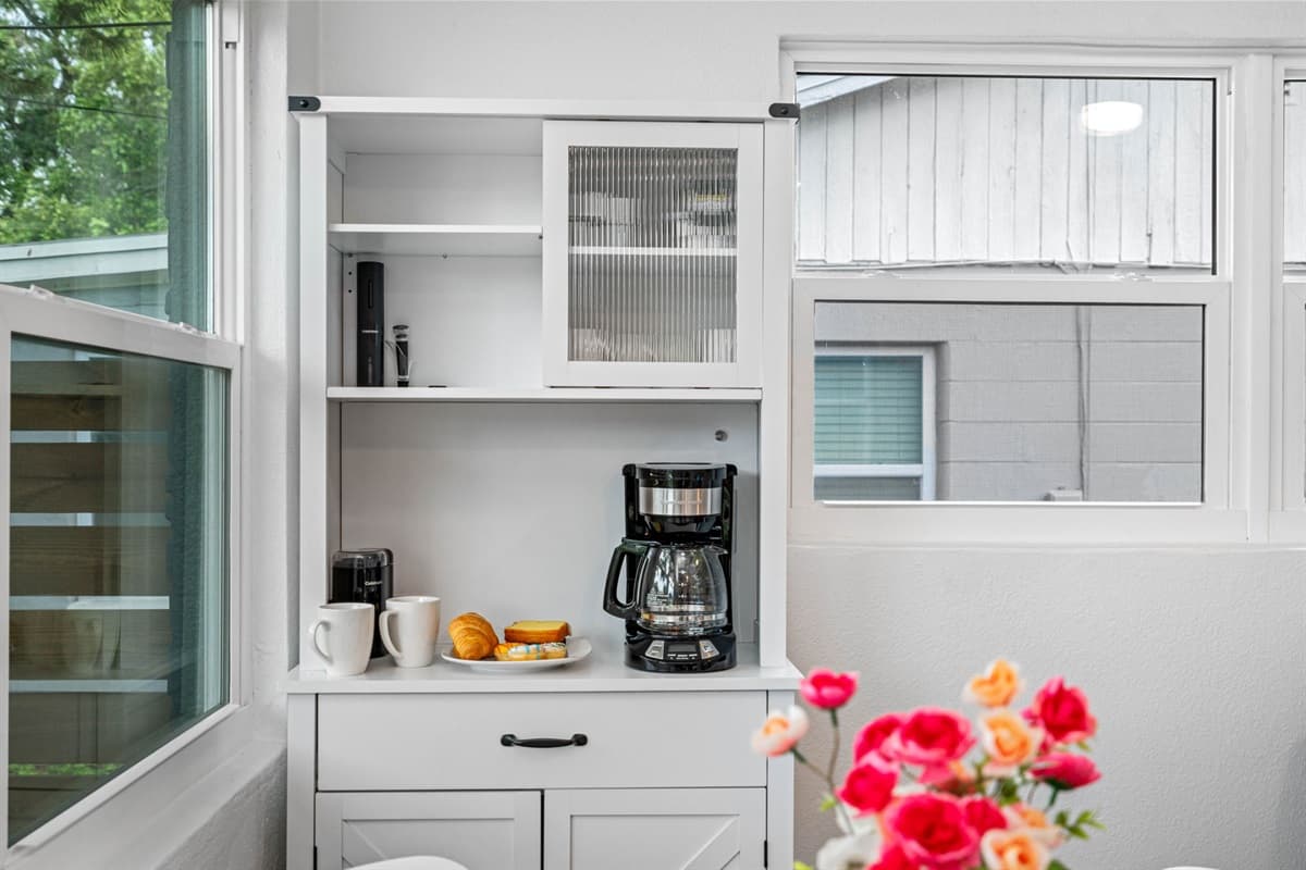 The kitchen's layout maximizes space and functionality, with plenty of storage options including cabinets and drawers that keep all your kitchen essentials organized and within reach.