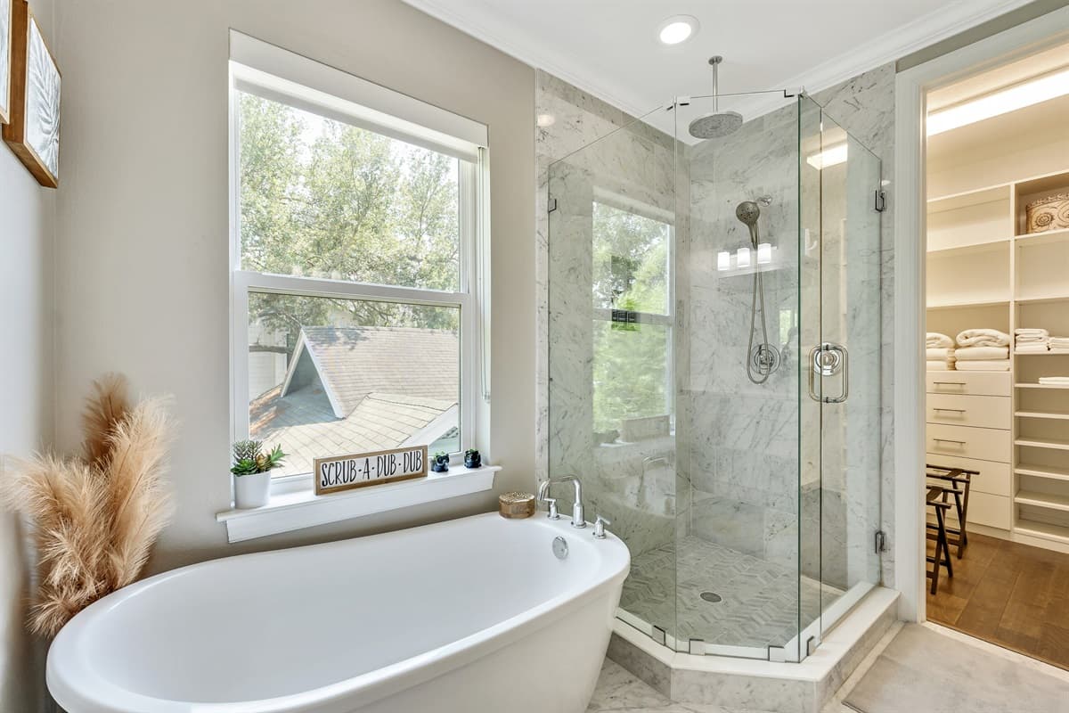 The sleek design of the tub adds a touch of elegance to the space, while the high-quality fixtures ensure a comfortable and enjoyable bathing experience.