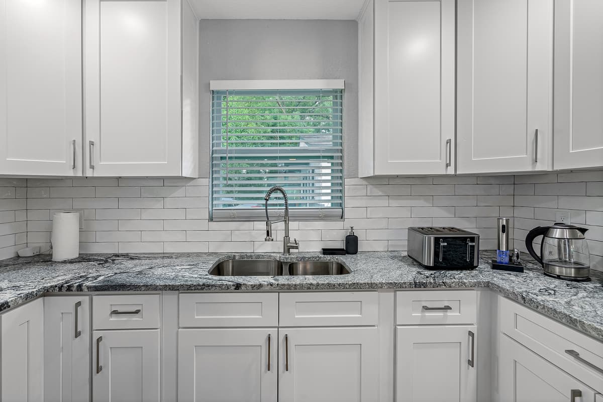 Our spacious modern kitchen has a lot of storage too! It's equipped with a dishwasher and has a lot of cabinets and drawers for kitchen tools and utensils. If you like this property, don't hesitate to send us a message.