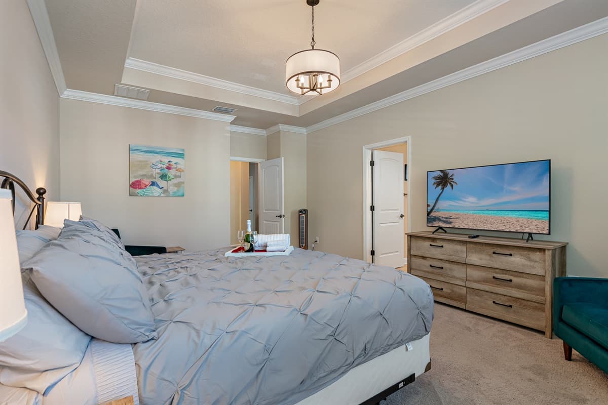 Comfortable bedroom with king  sized bed, smart TV and drawers. Sleep safe and sound on the comfort of your home away from home. 