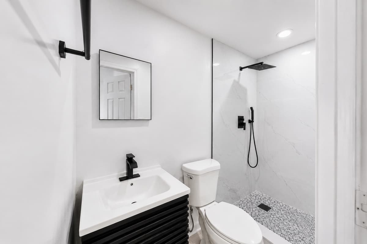 STUDIO UNIT
Private studio suite bathroom featuring a modern walk-in shower and updated fixtures for added comfort and convenience.