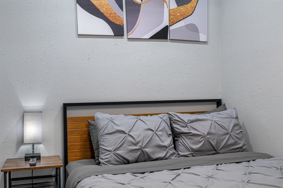 Cozy bedroom with a queen-sized bed, smart TV, and drawers for storage. This bedroom will surely make your stay in this property the best among others. Please send us an inquiry as soon as possible!
