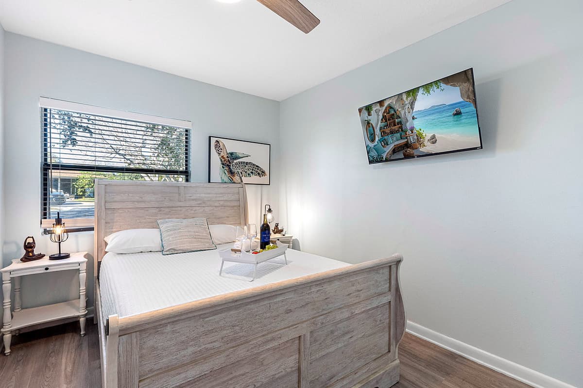 A bedside table with a stylish lamp offers convenient lighting for nighttime reading, while a spacious dresser and closet provide ample storage for personal belongings.