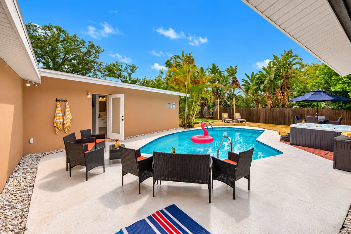Step outside and discover a dreamy outdoor space—complete with a heated pool, spa, BBQ grill, and multiple lounging zones.