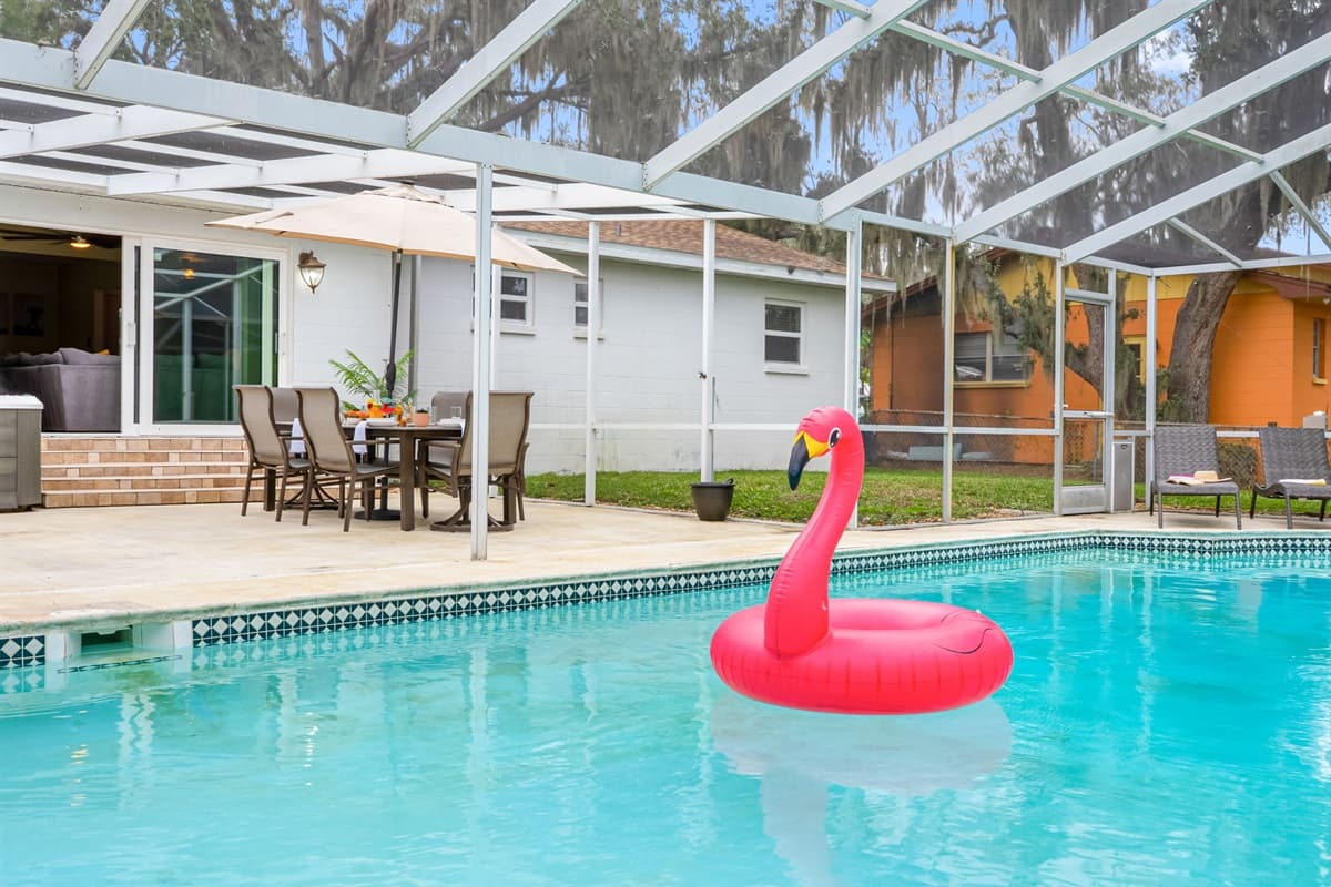 Spacious lanai with a sparkling pool, ideal for swimming, lounging, or family fun.