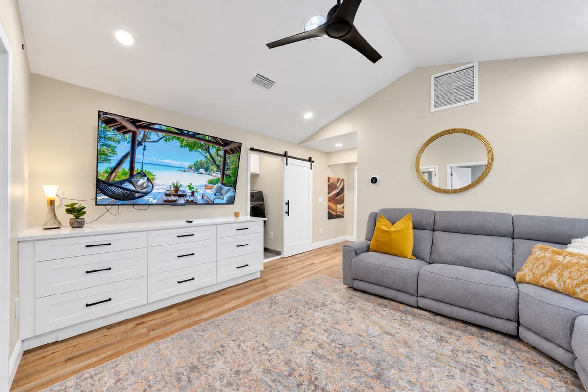 Your own lounge, your own screen, your own rules. Smart TV, deep sofa and a full dresser under vaulted ceilings — a self-contained wing for whoever wants a quieter version of the trip.