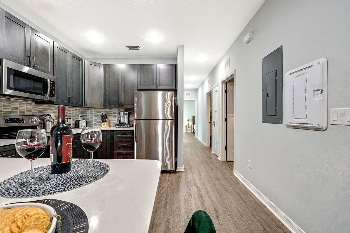 The open concept allows for seamless transitions between different cooking zones, making it a dynamic space for both solo endeavors and collaborative culinary creations.