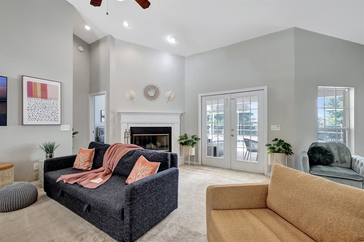 For a touch of whimsy and coziness, you'll find pastel-colored throw pillows scattered across the sofas and chairs.