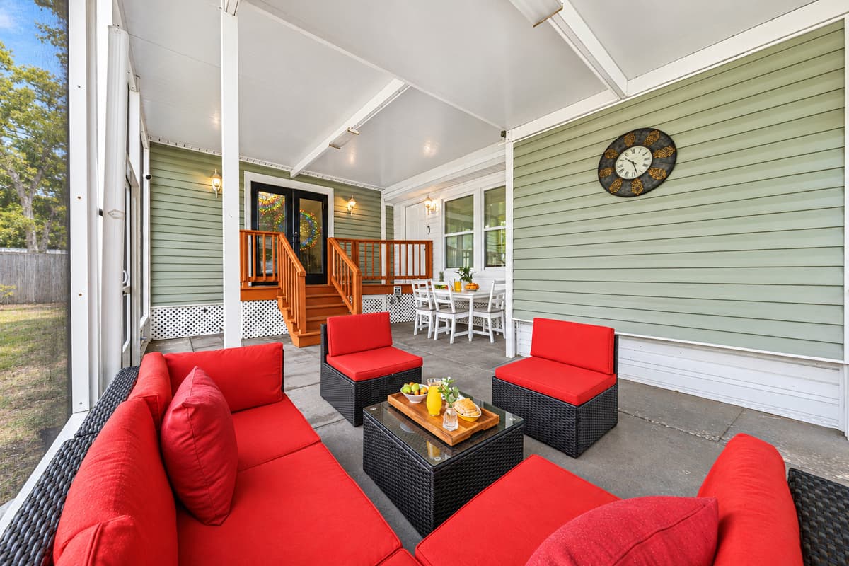 Covered outdoor patio with comfortable seating—ideal for relaxing and socializing.