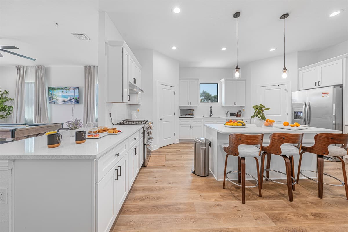 Walk-in pantry with open shelving, providing ample storage space for groceries and essentials.