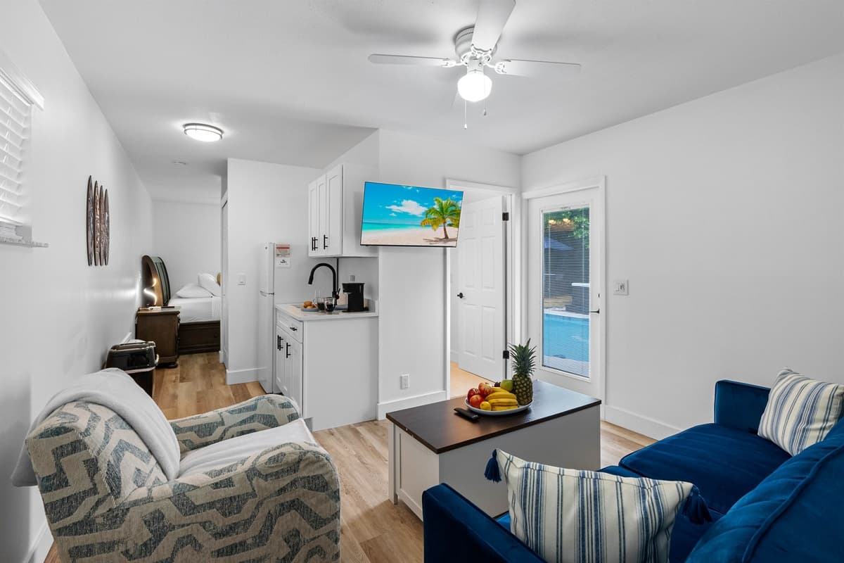 This stylish guest studio offers the perfect mix of relaxation and convenience, featuring a plush bed, personal sitting area, and a mini kitchen for your morning coffee or midnight snack.