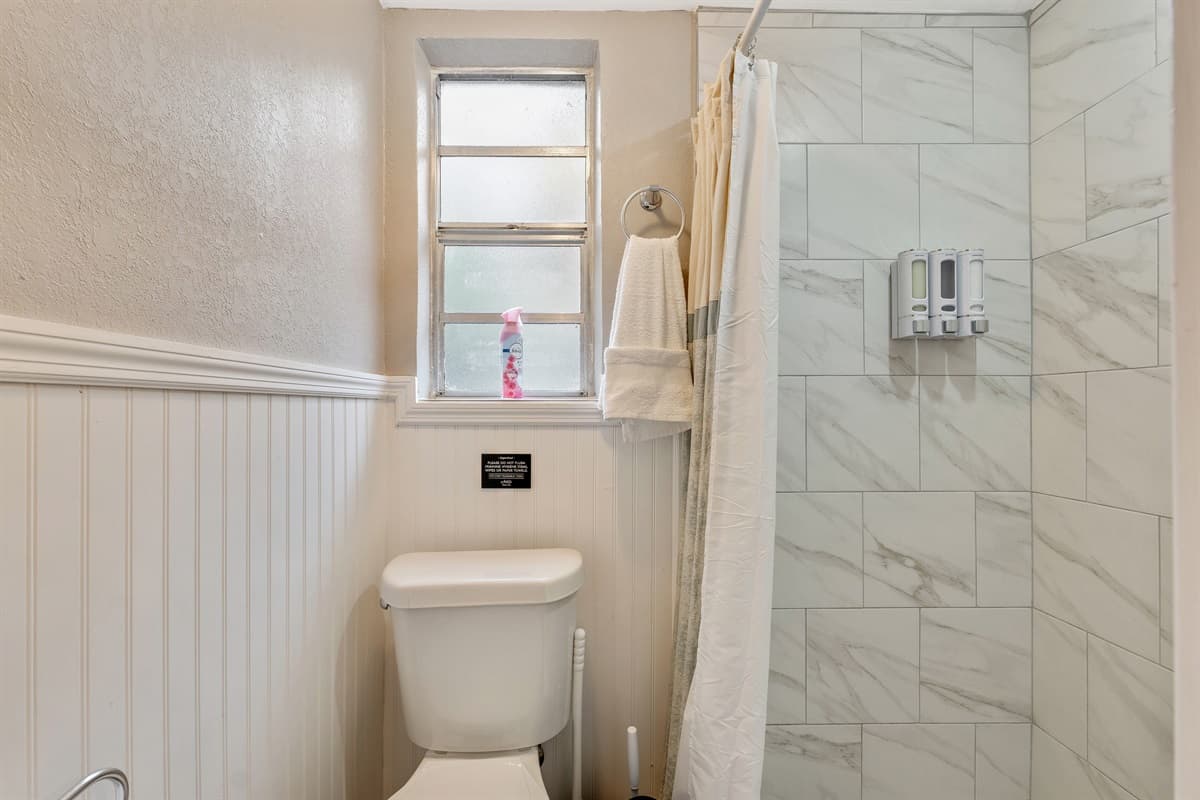 Immerse yourself in the invigorating cascade of the shower.