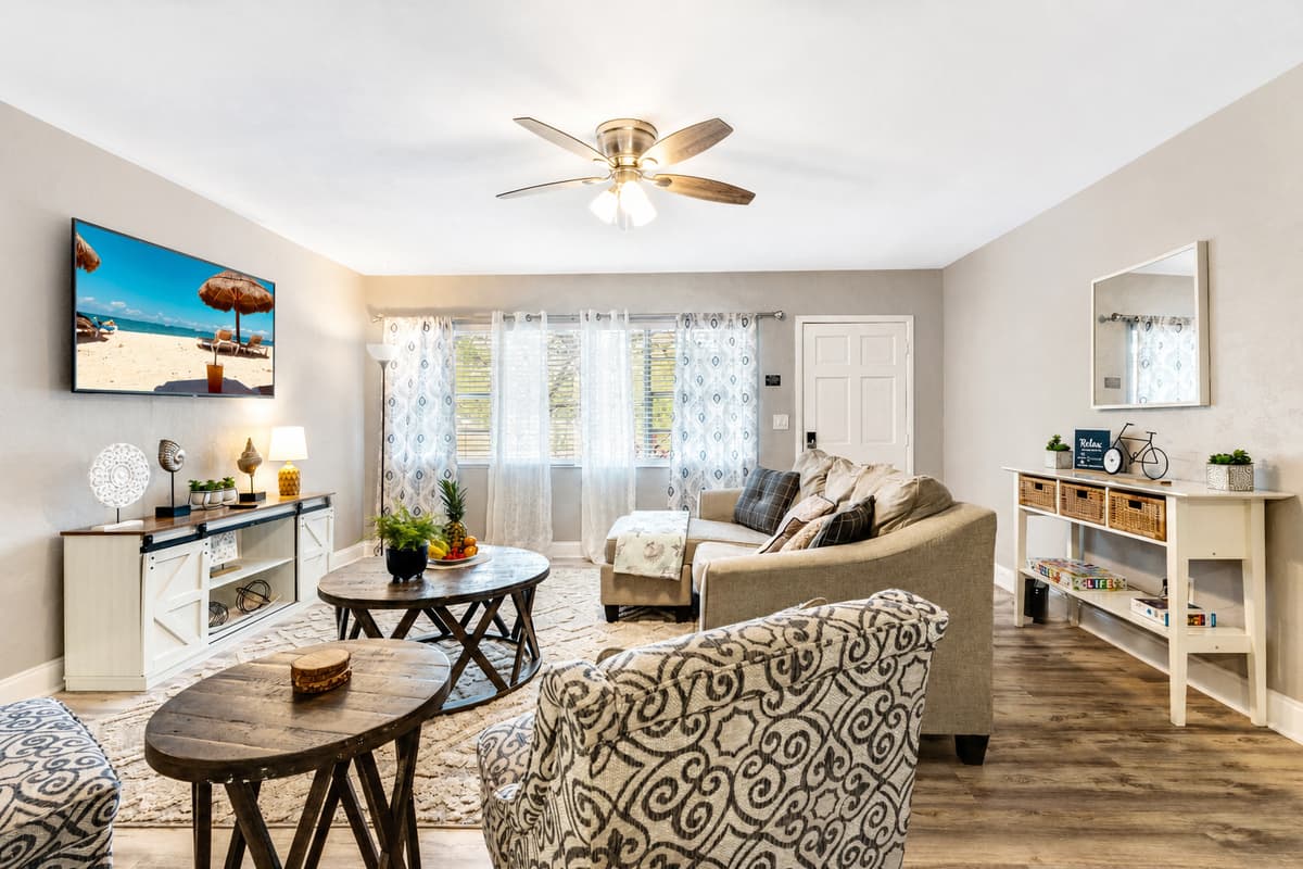 Bask in the natural glow from the expansive window, strategically placed to flood the living room with abundant natural light.