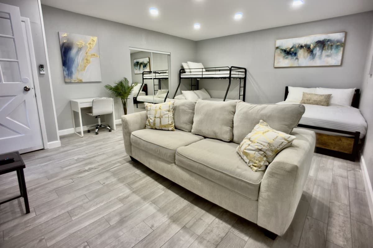 Designed for ultimate comfort, this expansive suite features a queen-size bed, a bunk bed, and a soft sofa, making it ideal for families or groups.