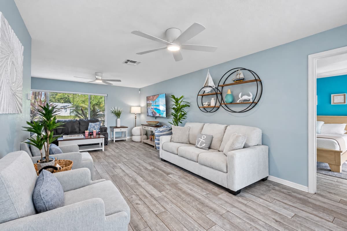 Calming blue tones and nautical accents create a serene coastal vibe throughout this inviting space.