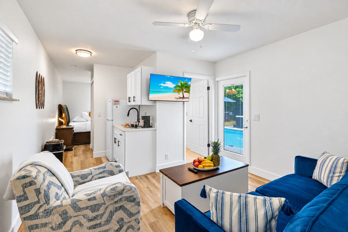 This stylish guest studio offers the perfect mix of relaxation and convenience, featuring a plush bed, personal sitting area, and a mini kitchen for your morning coffee or midnight snack.