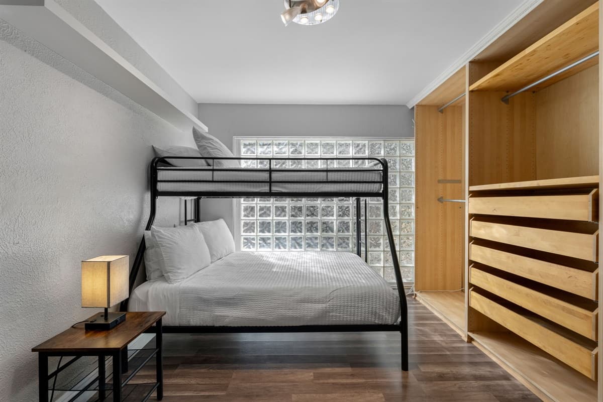 The adjoining bunk area makes this master suite ideal for parents with kids or close friends.