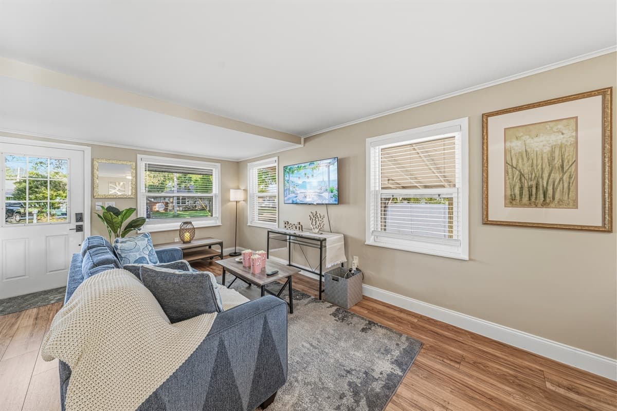 Bright, open living area with plenty of natural light and comfortable seating.