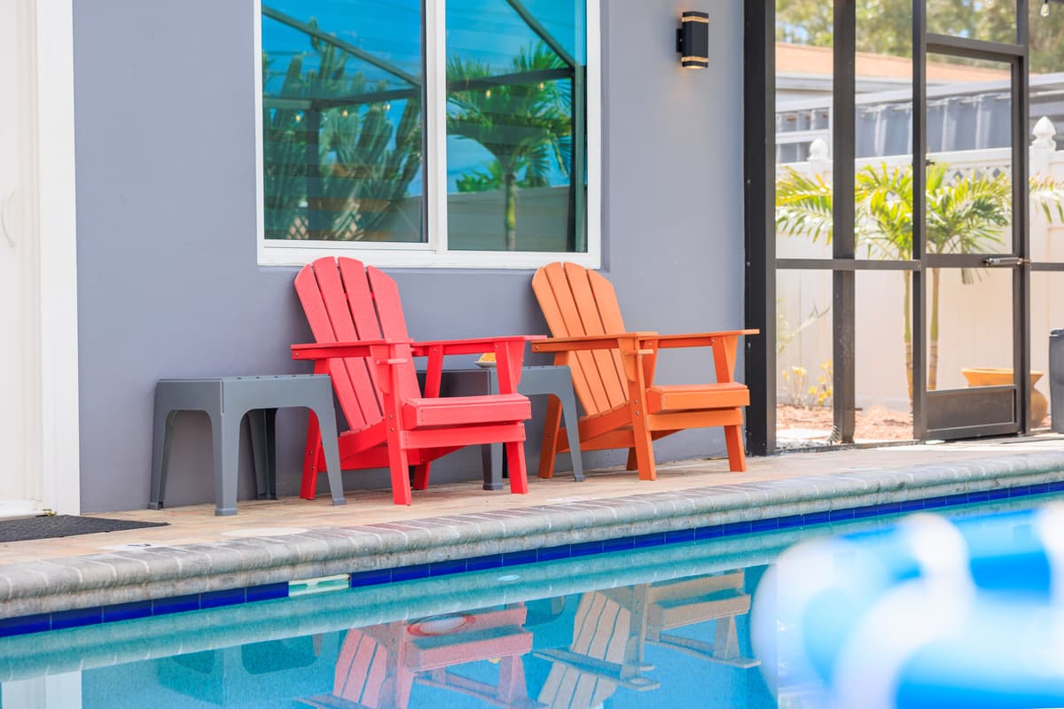 Screened-in pool and outdoor lounge space.