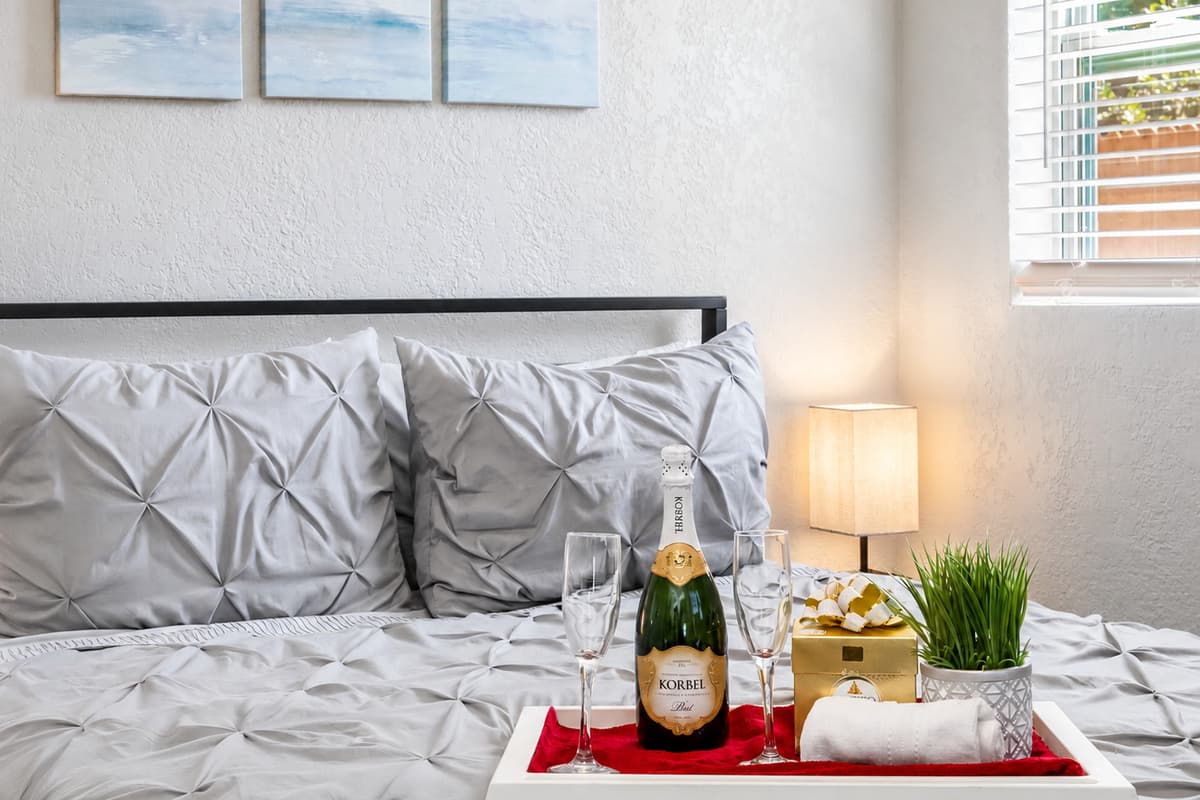 The décor of the bedroom is both refined and welcoming, with subtle accents that add a touch of sophistication to the space.