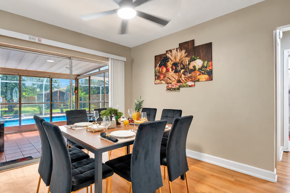The centerpiece of this space is an expansive 8-seater dining table, providing ample room for you and your guests to savor delightful meals and engaging conversations.