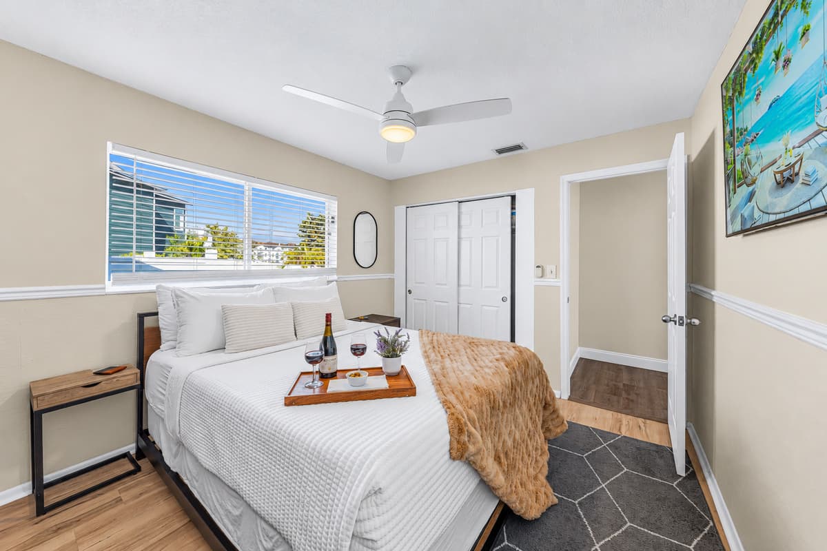 Bright and inviting queen bedroom designed for a restful night's sleep.