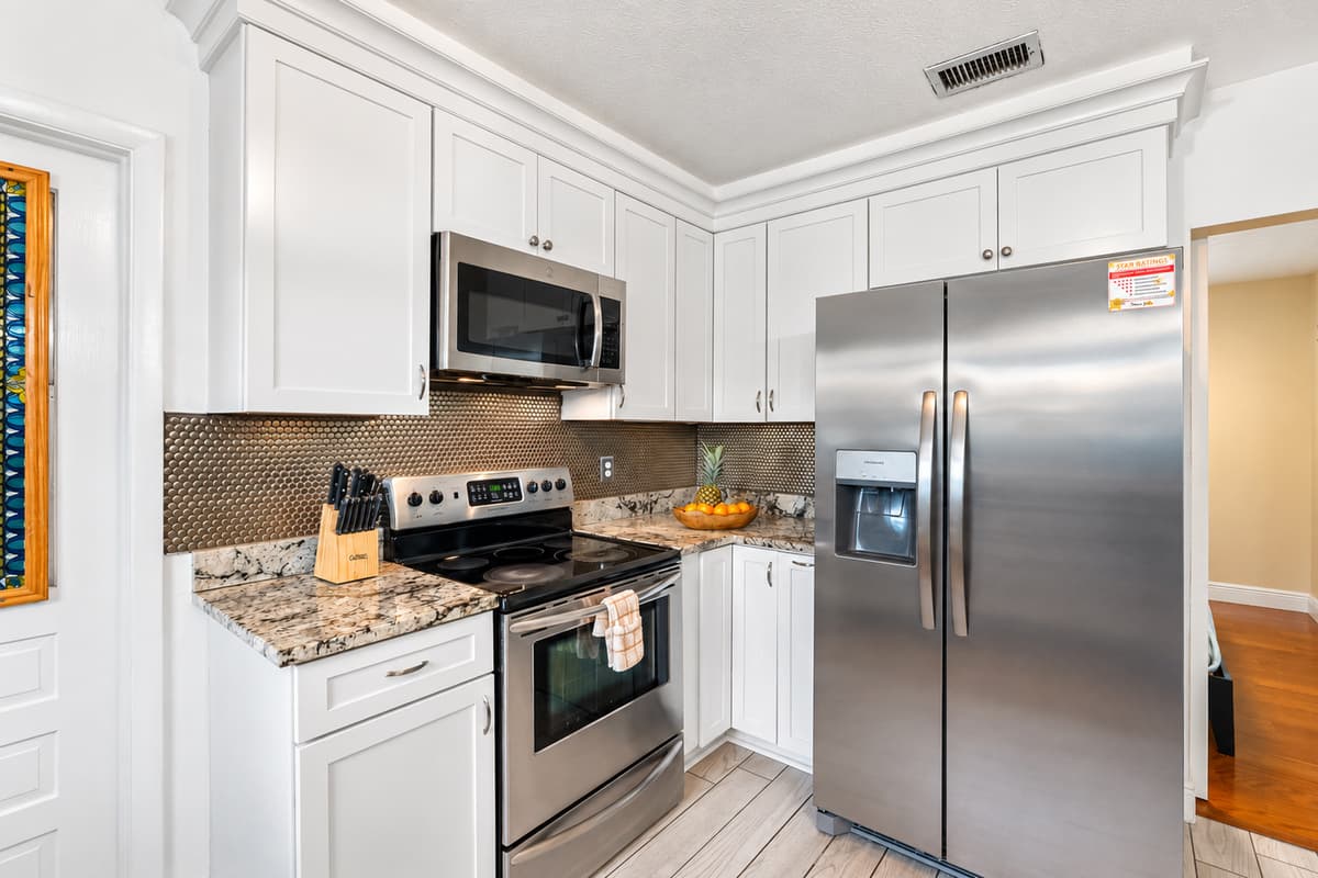 Enjoy meal prep in this clean, updated kitchen with high-end appliances and plenty of storage.