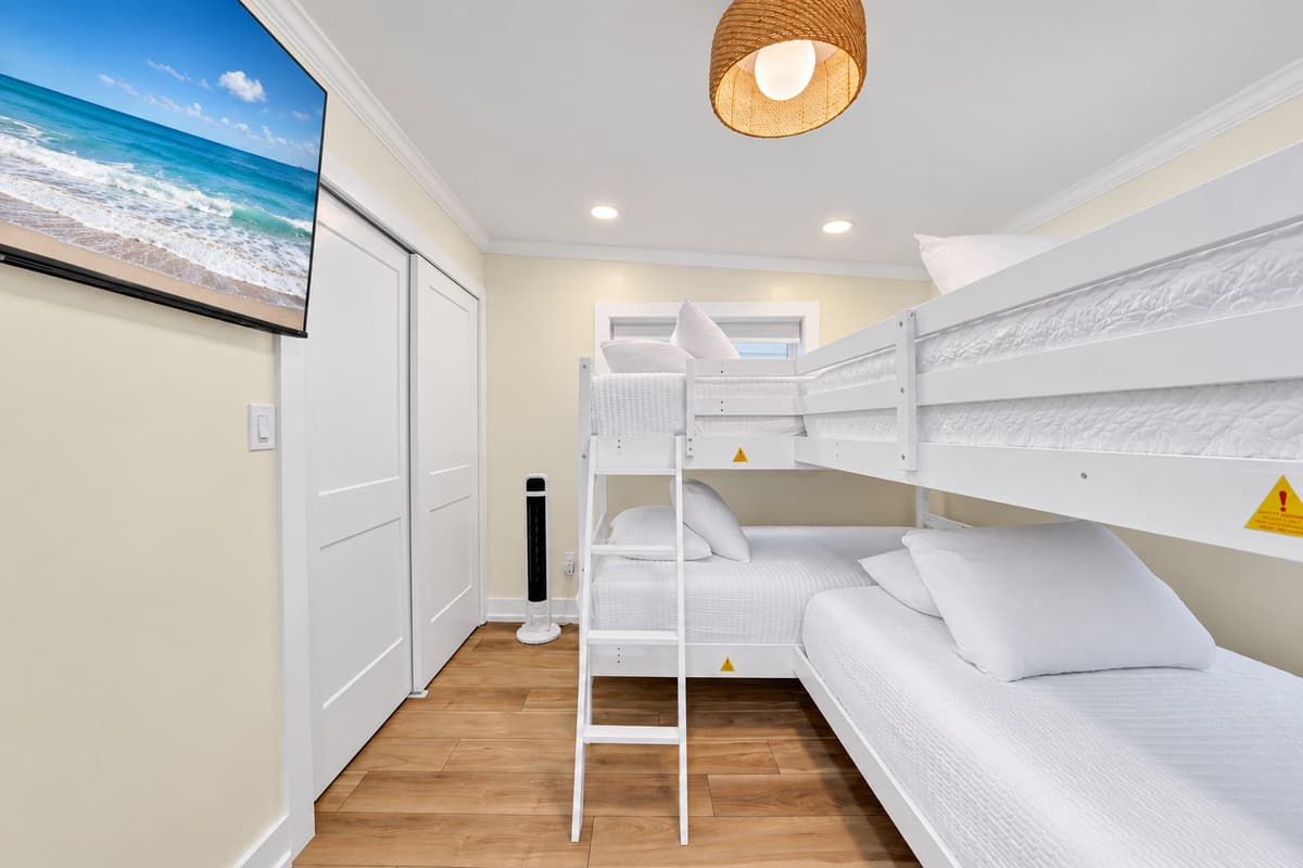 Bunks, a TV and fun for the kids. Two twin-over-twin bunks, a wall TV and a closet. The kids get their own room and the adults get some peace and quiet.