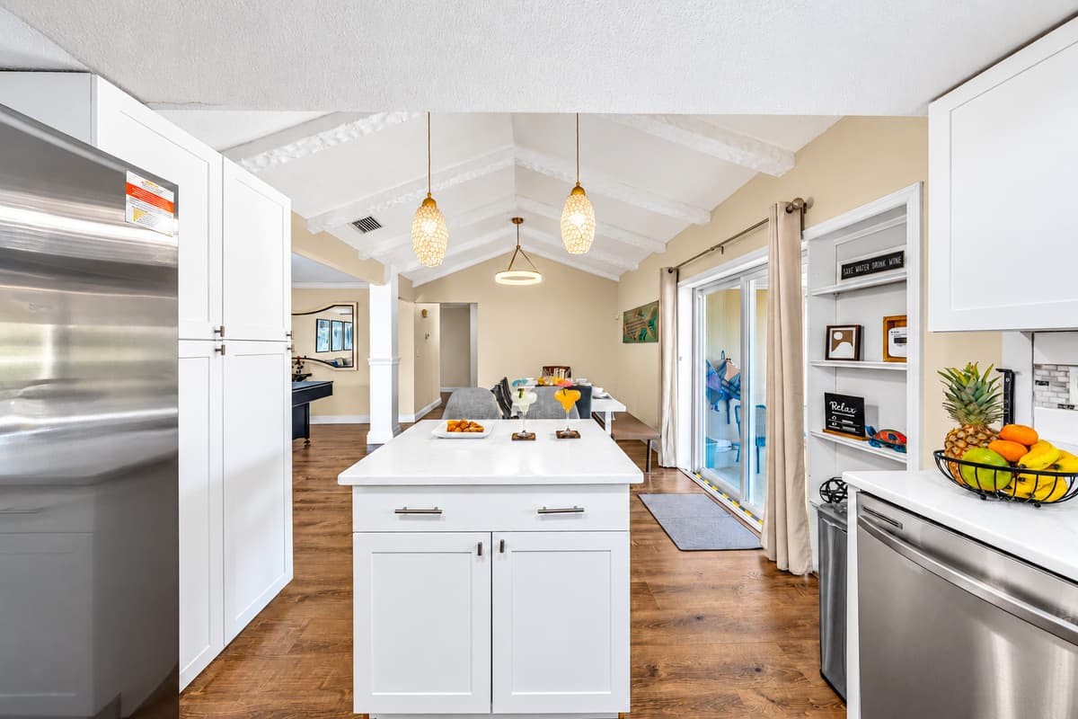 Fully equipped kitchen featuring stainless steel appliances and generous counter space.