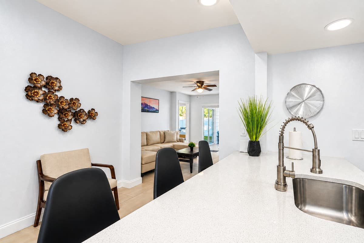 Bright and modern kitchen with stylish décor, bar seating, and spacious counters.