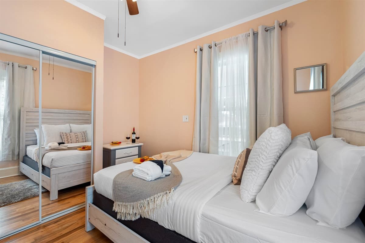 Designed with comfort in mind, this bedroom features a cozy bed adorned with soft linens and plush pillows, ensuring a restful and peaceful night’s sleep.
