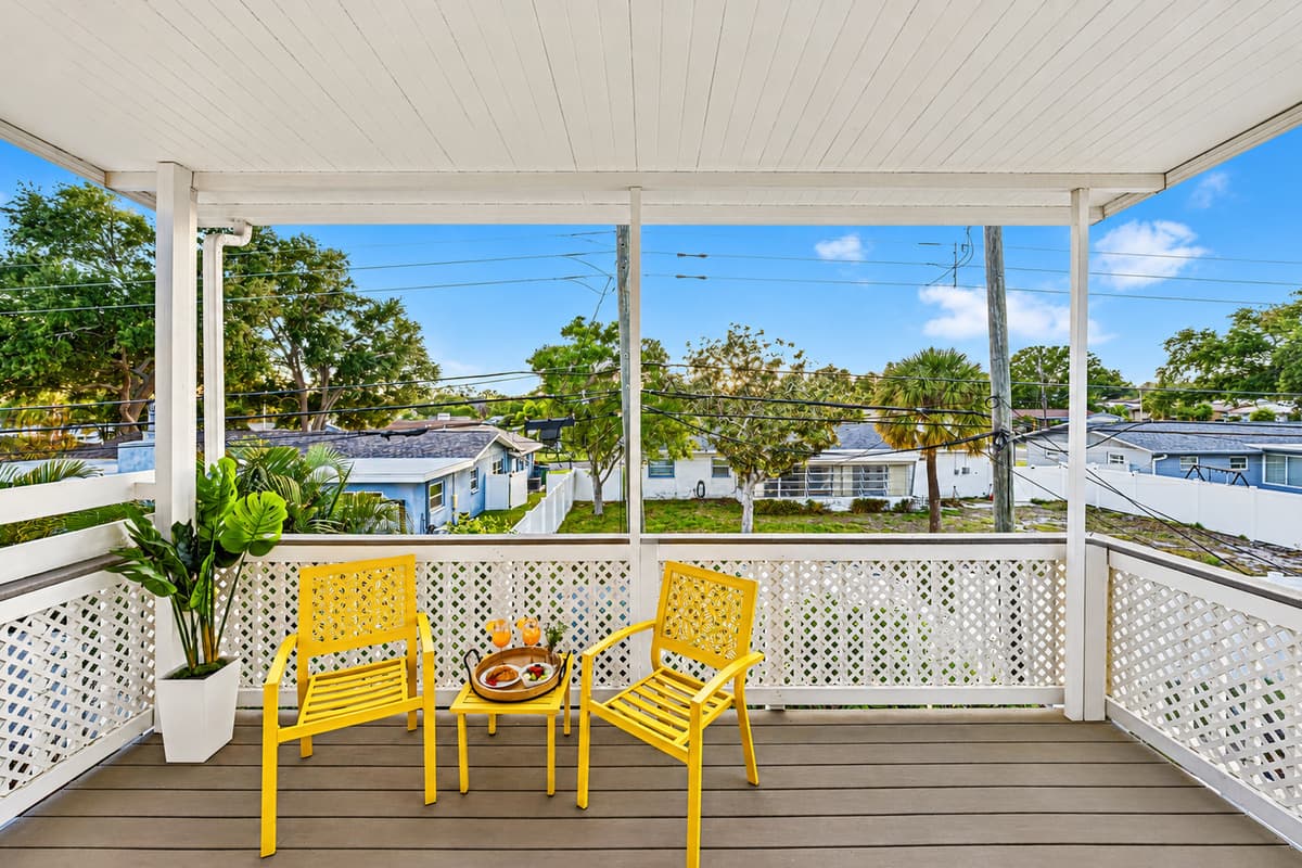 Wide balcony space with seating for multiple guests—perfect for enjoying fresh air and sunshine 