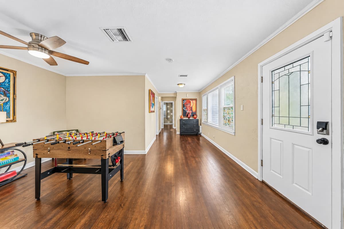 Long entertainment space with foosball table and plenty of room to relax or play.