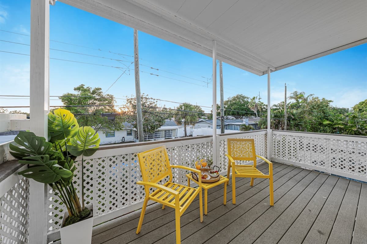 Cozy outdoor seating area with stylish décor and open-air views—great for unwinding 
Food and drinks shown are for staging purposes only and are not included.