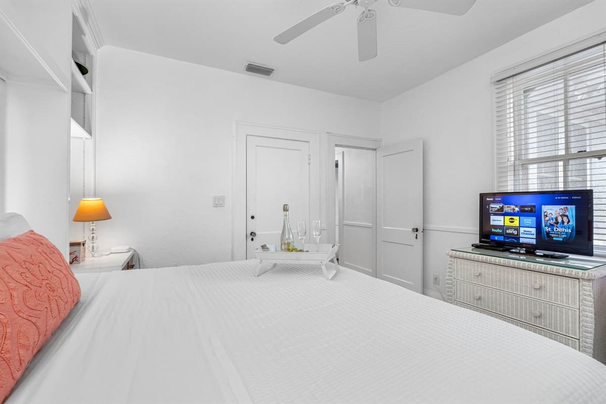 The surrounding decor complements the bed's grandeur, creating an atmosphere of tranquility and warmth.