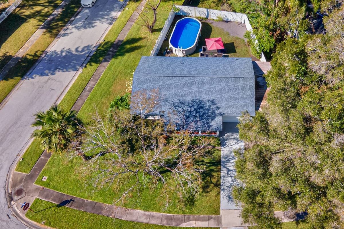 Aerial side view of our amazing property! Worry not about kids playing in the fully fenced backyard during your stay! Inquire about this property now!