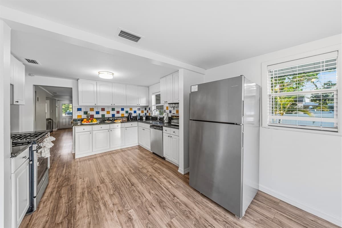 Bright kitchen with generous space and modern appliances for convenience.