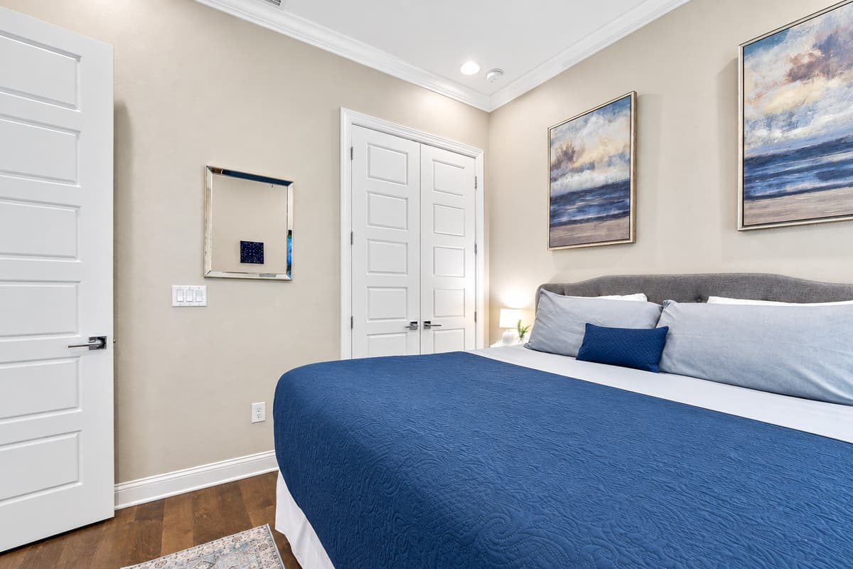 This queen-size bedroom is designed to offer both comfort and sophistication, providing a tranquil retreat for guests seeking a restful stay.