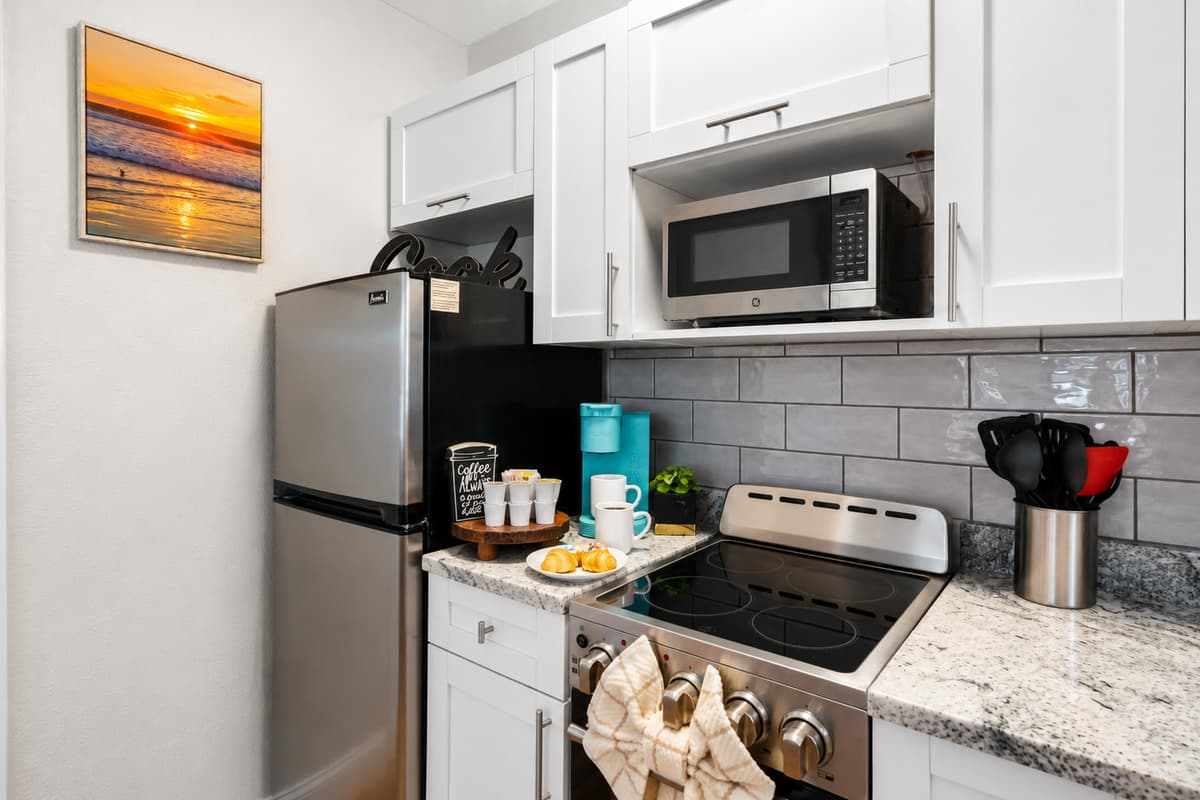 Prepare meals or beach snacks in the stylish kitchen complete with a refrigerator, microwave, stove, coffee maker, and all the essentials.