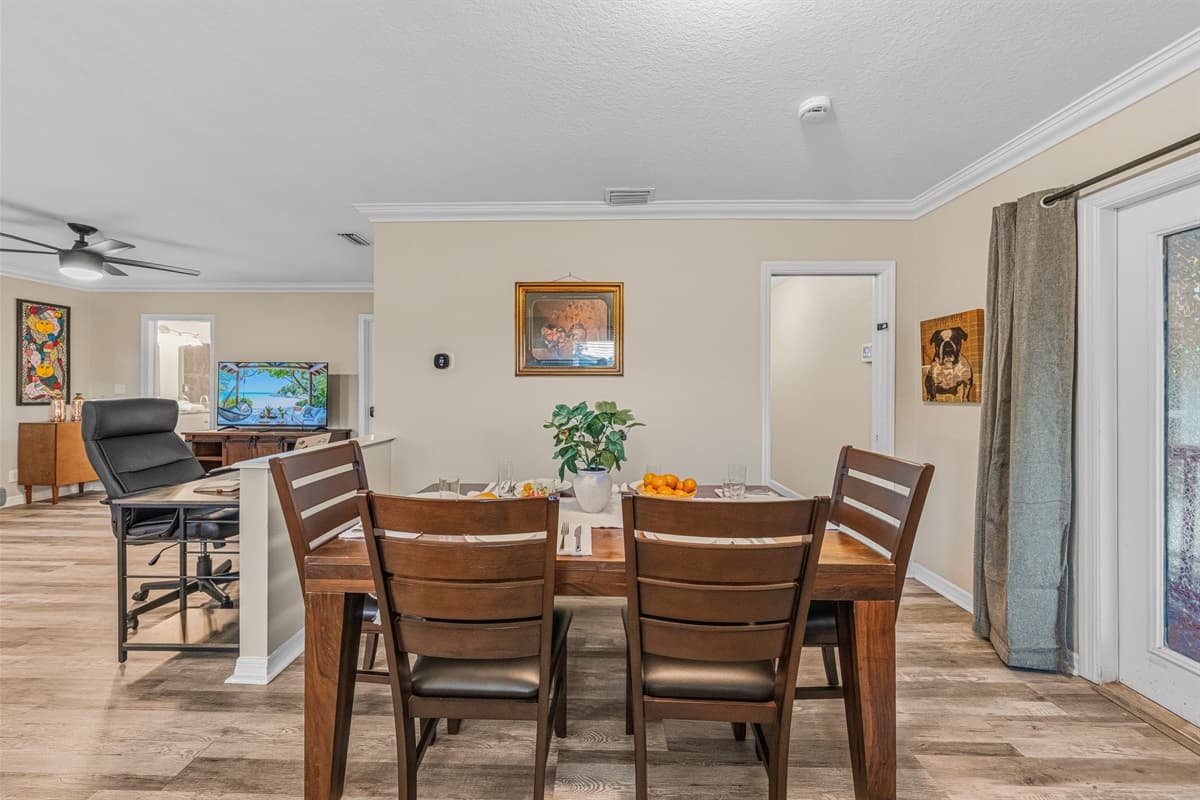 Open dining space flowing into the living room, creating a warm and social atmosphere.