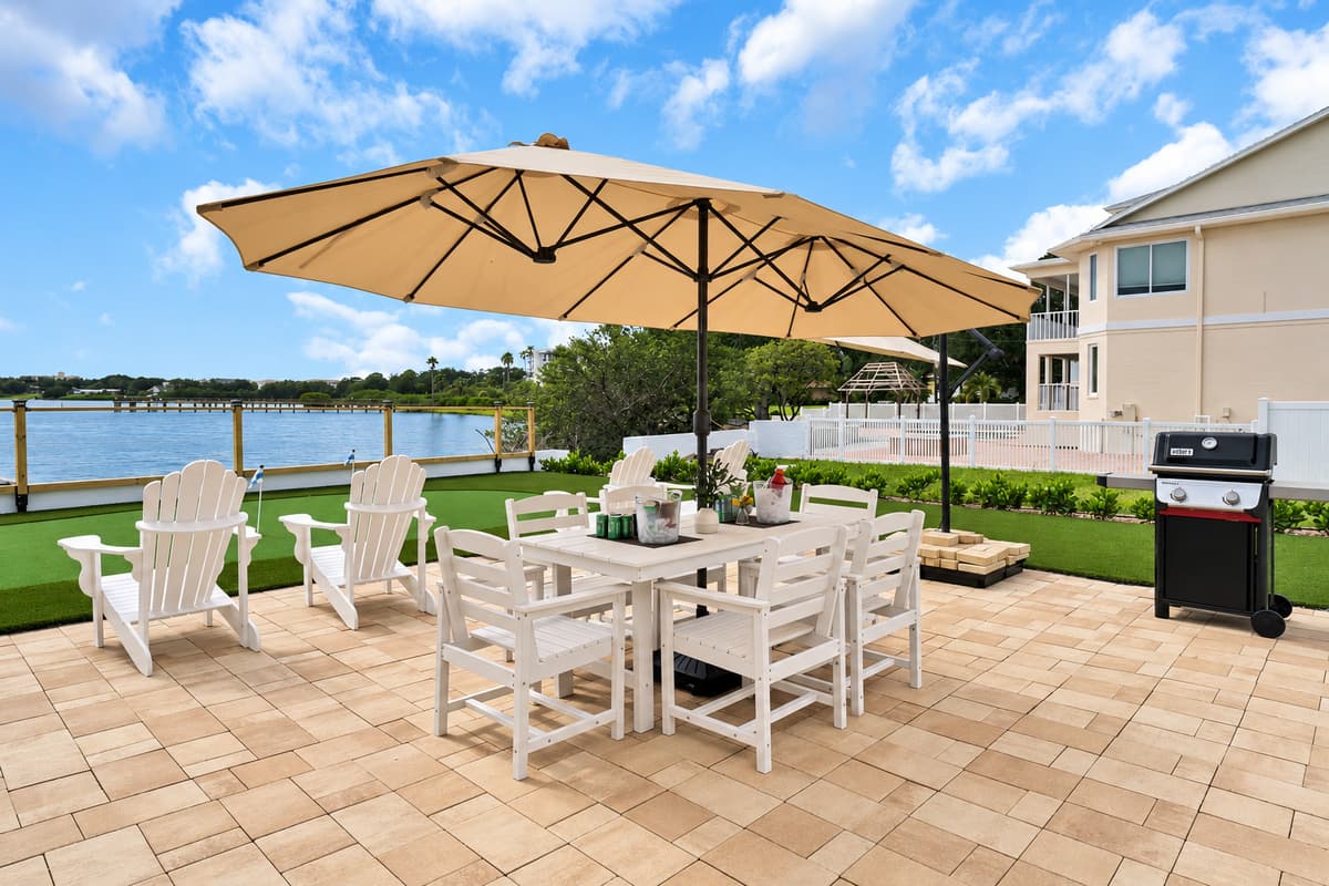 Dinner on the patio, bay in front of you. A large outdoor dining table under big umbrellas, a gas grill and Adirondack chairs, all facing the water. Eat, laugh and stay until the stars come out.