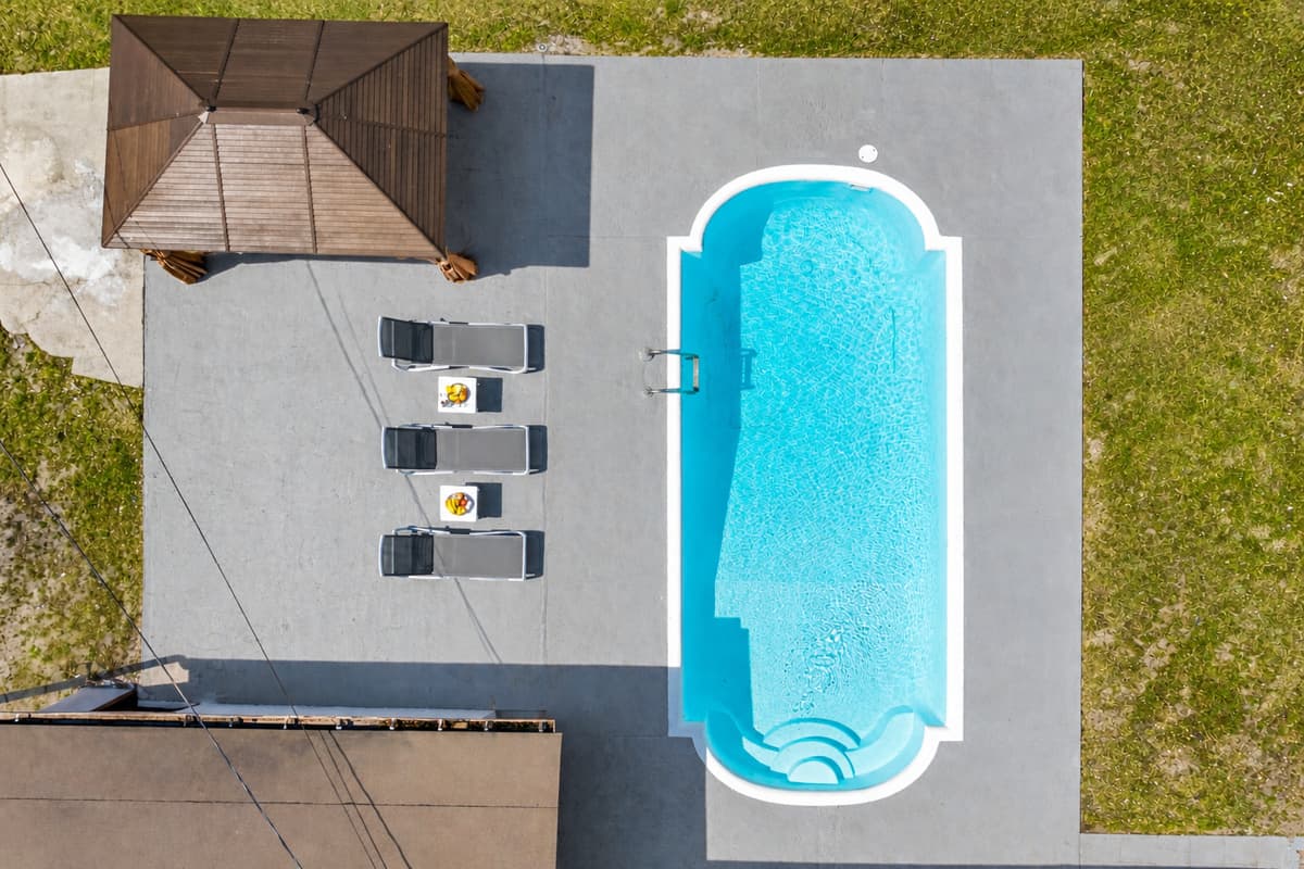 As you soar over the property, you'll see the crystal clear waters of the pool shimmering in the sunlight.
