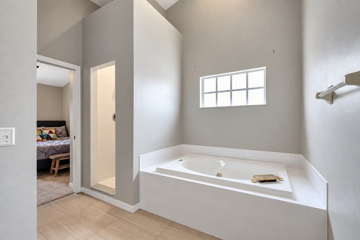 As you enter, you'll be greeted by an elegant bathtub, inviting you to immerse yourself in a soothing bubble bath or indulge in a moment of quiet contemplation.