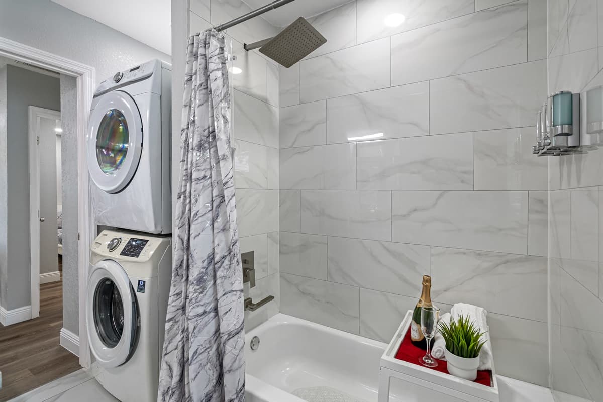 Enjoy a relaxing bath after a long day of travel from your home to your home away from home. Stunning bathroom has his and hers sink, toilet, bathtub and a shower.