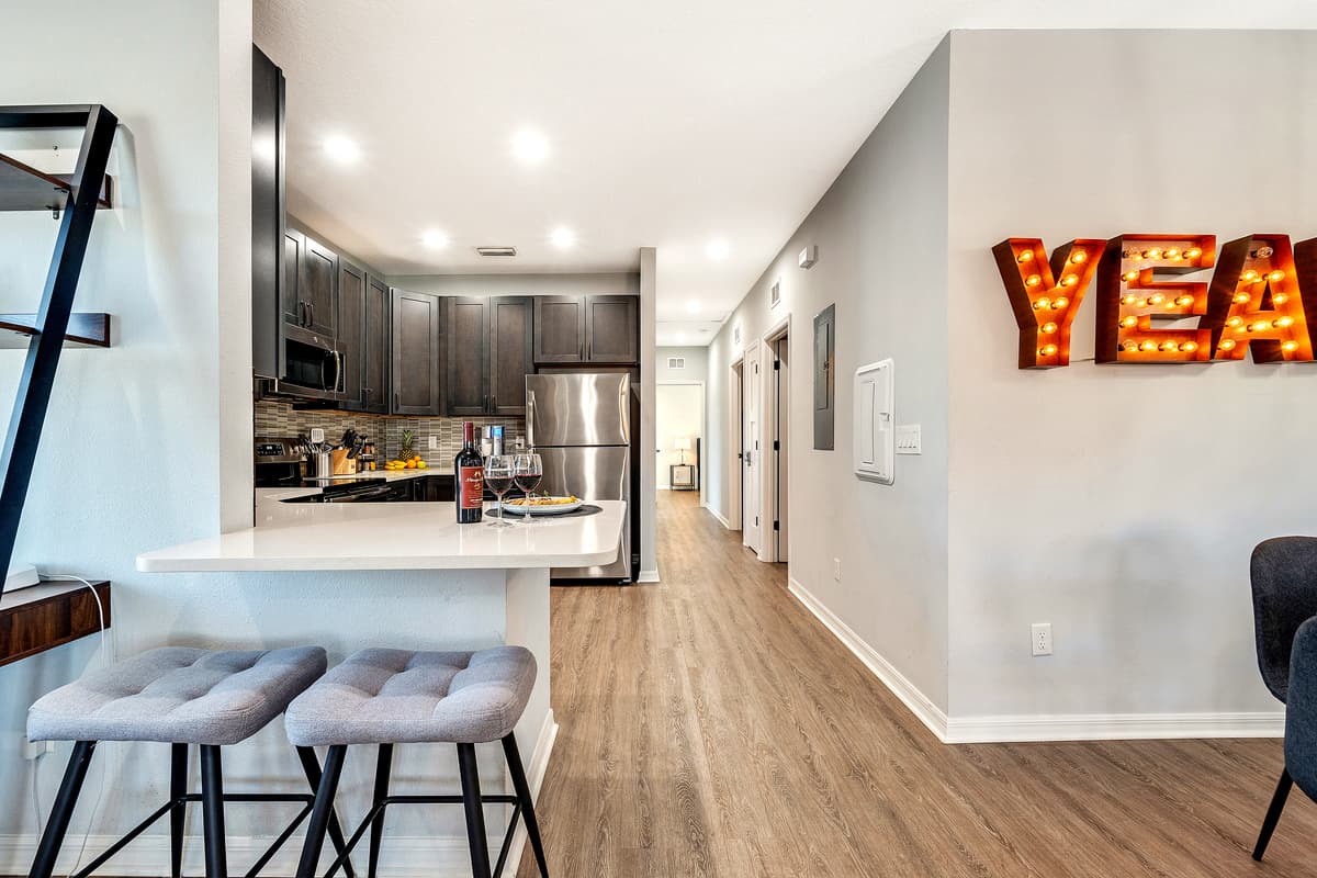 The kitchen stands as the heart of the home, a spacious retreat boasting a contemporary design and an array of modern conveniences. 