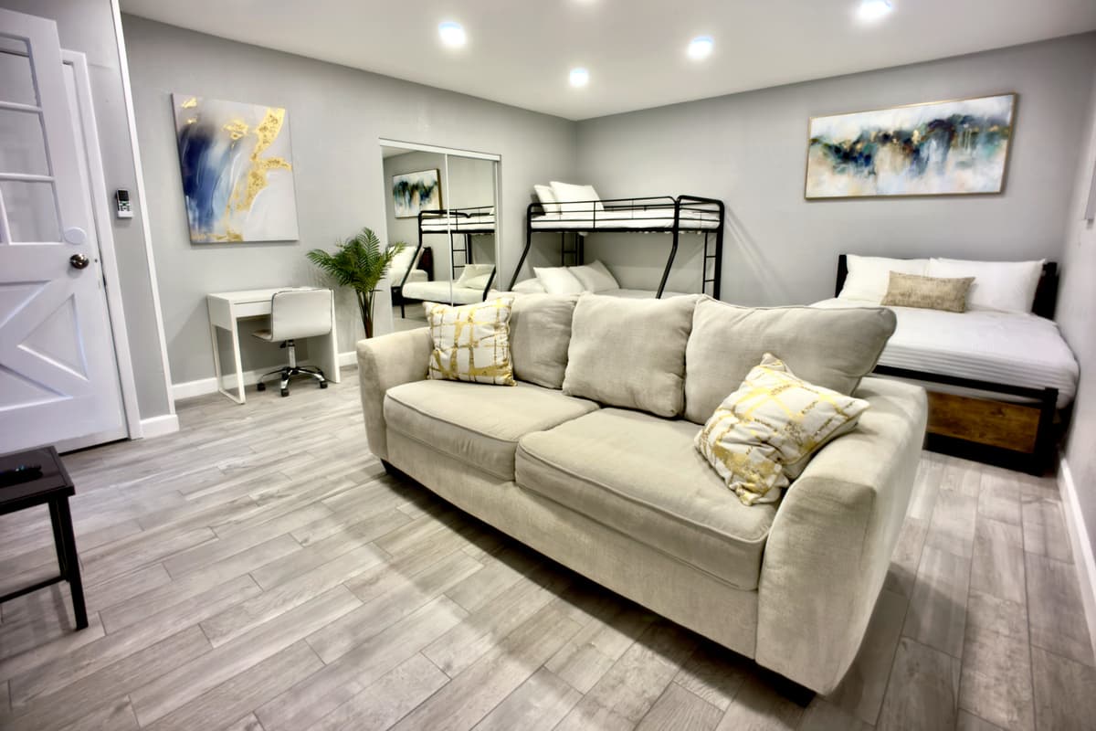 Designed for ultimate comfort, this expansive suite features a queen-size bed, a bunk bed, and a soft sofa, making it ideal for families or groups.