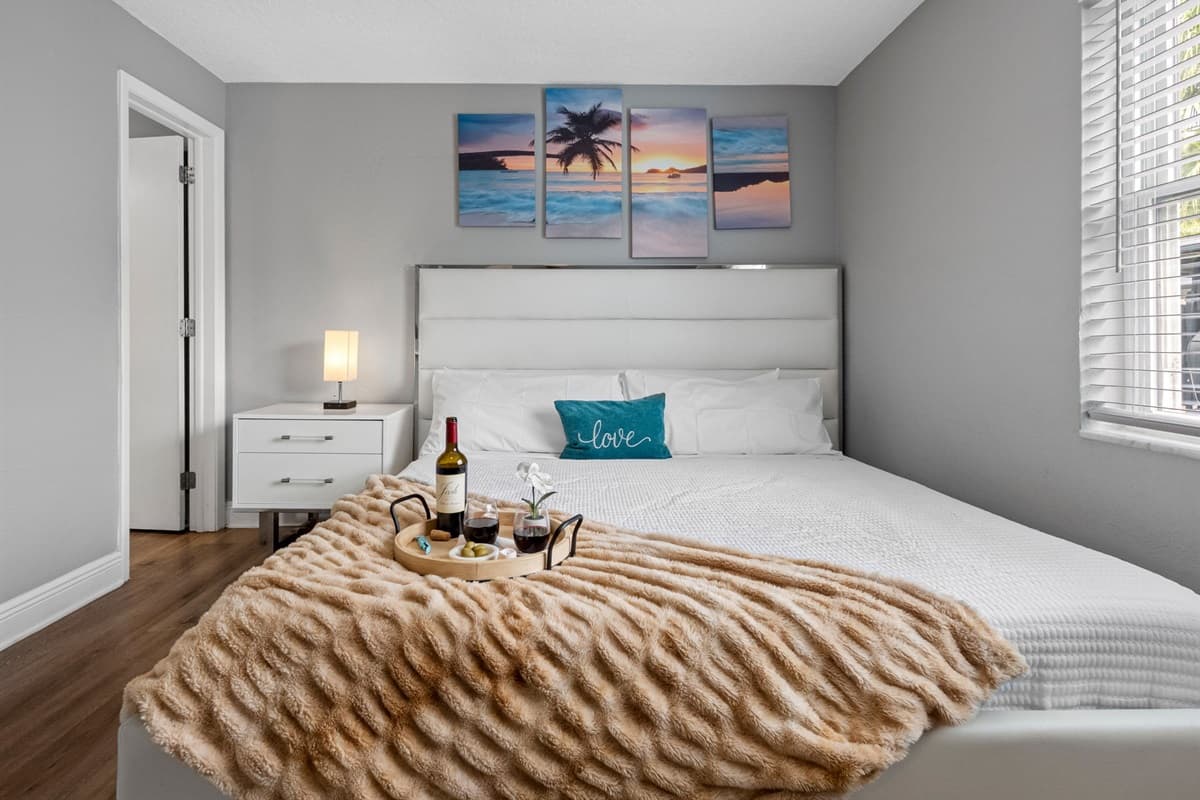 Everything you need for a perfect night in—stylish furnishings, blackout blinds, a ceiling fan, and entertainment right at your fingertips.