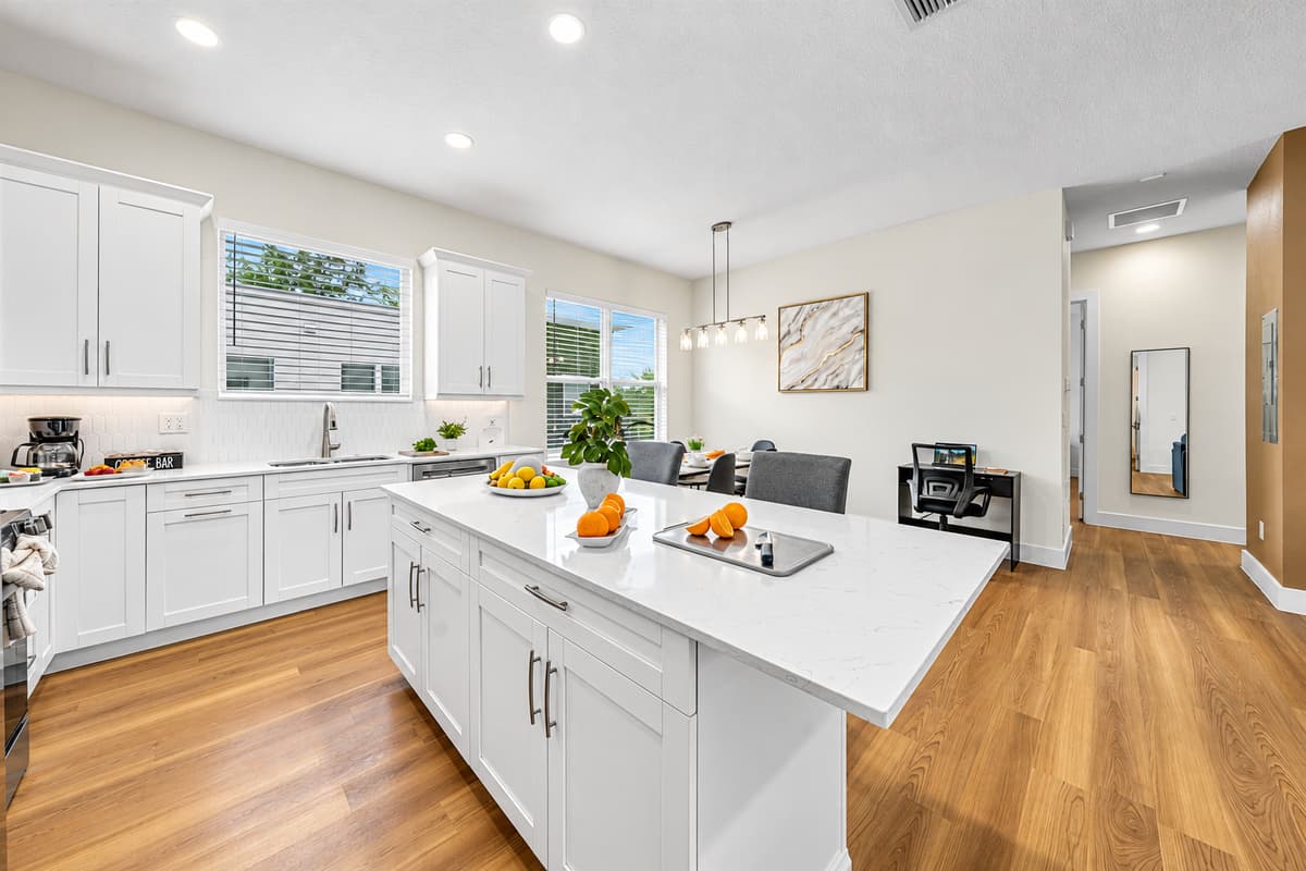 Bright kitchen with large island and modern finishes throughout.